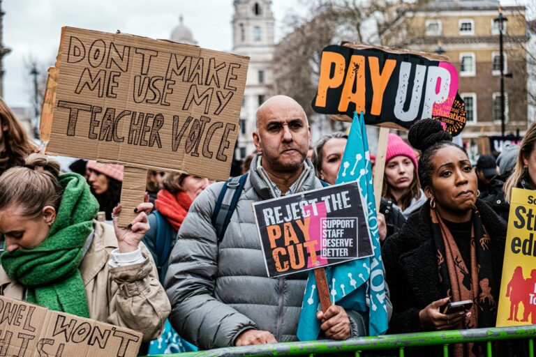 Teachers join a protest in London demanding fair pay and better conditions.